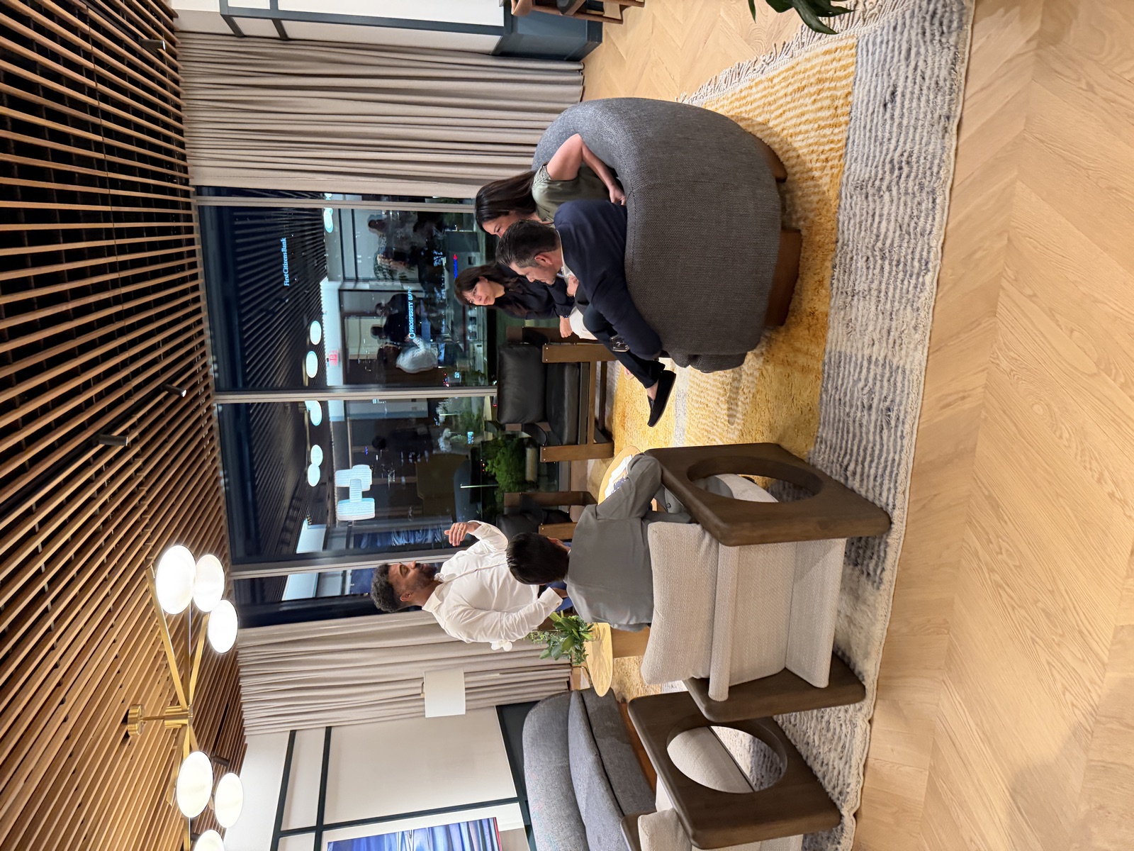 Small group listening to a speaker during a private gathering at the PushFire office.